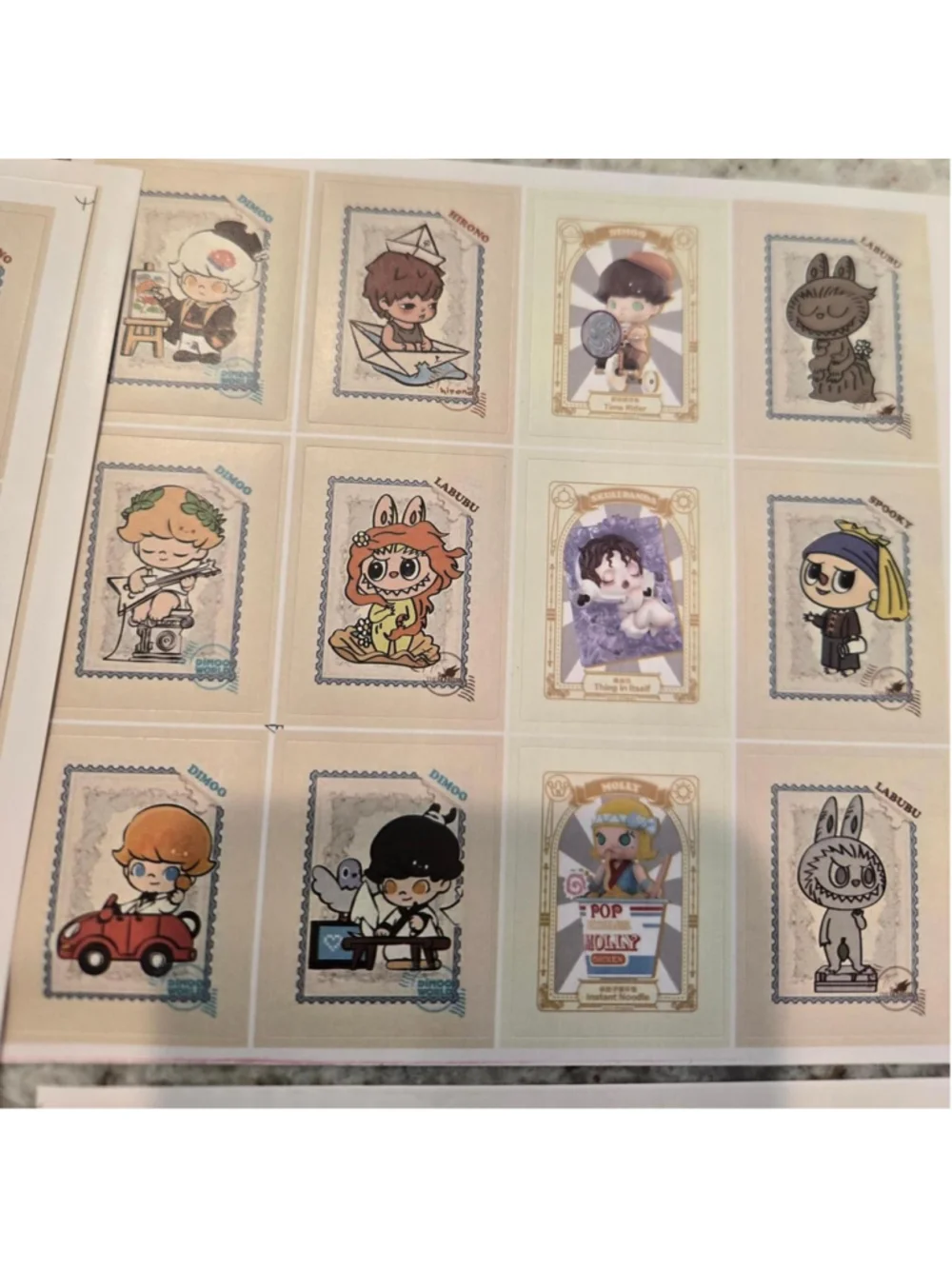6 sticker sheets that are size 5 in by 5 in - pop mart characters